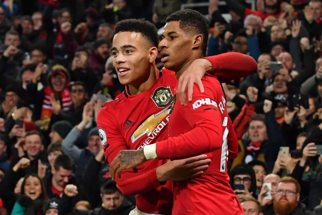 Manchester United's English striker Marcus Rashford (R) celebrates with Manchester United's English striker Mason Greenwood (L) after scoring their third goal during the English Premier League football match between Manchester United and Newcastle United at Old Trafford in Manchester, north west England, on December 26, 2019. (Photo by Paul ELLIS / AFP) / RESTRICTED TO EDITORIAL USE. No use with unauthorized audio, video, data, fixture lists, club/league logos or 'live' services. Online in-match use limited to 120 images. An additional 40 images may be used in extra time. No video emulation. Social media in-match use limited to 120 images. An additional 40 images may be used in extra time. No use in betting publications, games or single club/league/player publications. /  (Photo by PAUL ELLIS/AFP via Getty Images)