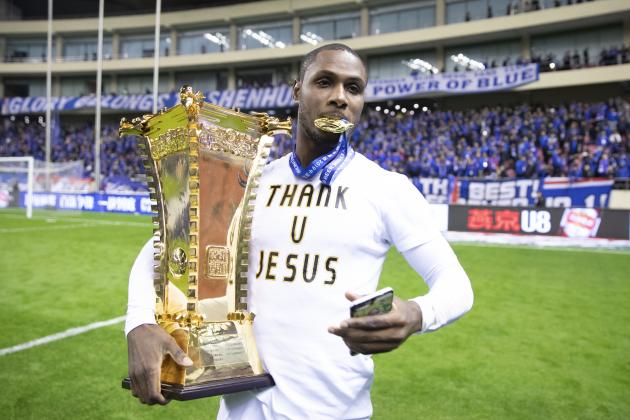 SHANGHAI, CHINA - DECEMBER 06: Odion Ighalo of Shanghai Greenland Shenhua and teammates celebrate with the trophy during the award ceremony after the 2019 CFA Cup Final - Shanghai Greenland Shenhua v Shandong Luneng Taishan at Shanghai Hongkou Football Stadium on December 6, 2019 in Shanghai, China.  (Photo by Fred Lee/Getty Images)