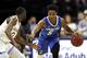 Creighton guard Ty-Shon Alexander (5) drives to the basket past Seton Hall guard Quincy McKnight during the first half of an NCAA college basketball game Wednesday, Feb. 12, 2020, in Newark, N.J.. (AP Photo/Adam Hunger)