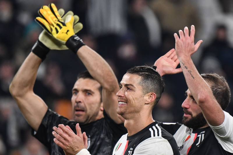 TOPSHOT - (From L) Juventus' Italian goalkeeper Gianluigi Buffon, Juventus' Portuguese forward Cristiano Ronaldo and Juventus' Argentinian forward Gonzalo Higuain acknowledge the public at the end of the Italian Cup (Coppa Italia) round of 8 football match Juventus vs AS Roma on January 22, 2020 at the Juventus stadium in Turin. (Photo by Marco Bertorello / AFP) (Photo by MARCO BERTORELLO/AFP via Getty Images)