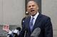 FILE - In this Tuesday, July 23, 2019 file photo, Michael Avenatti makes a statement to the press as he leaves federal court, in New York. Lawyer Michael Avenatti says charging Nike $25 million to probe corruption at the sportswear giant was a bargain rather than extortion. An attorney for Avenatti told a judge Thursday, Aug. 22, 2019 that a November extortion trial should be postponed until January so he can gather more proof. (AP Photo/Richard Drew, File)