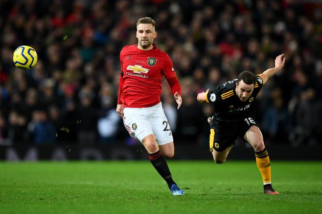 MANCHESTER, ENGLAND - FEBRUARY 01: Luke Shaw of Manchester United avoids a challenge from Diogo Jota of Wolverhampton Wanderers during the Premier League match between Manchester United and Wolverhampton Wanderers at Old Trafford on February 01, 2020 in Manchester, United Kingdom. (Photo by Clive Mason/Getty Images)