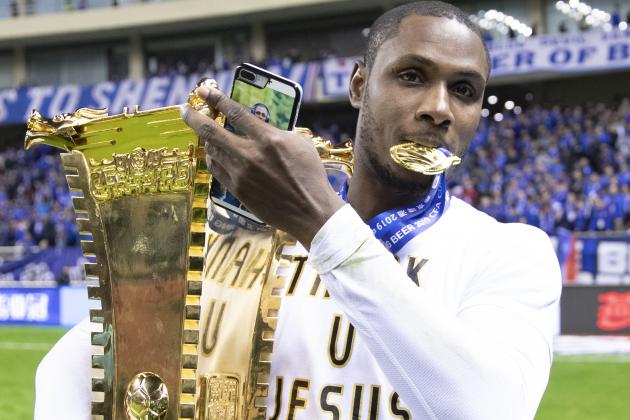 SHANGHAI, CHINA - DECEMBER 06: Odion Ighalo of Shanghai Greenland Shenhua and teammates celebrate with the trophy during the award ceremony after the 2019 CFA Cup Final - Shanghai Greenland Shenhua v Shandong Luneng Taishan at Shanghai Hongkou Football Stadium on December 6, 2019 in Shanghai, China.  (Photo by Fred Lee/Getty Images)