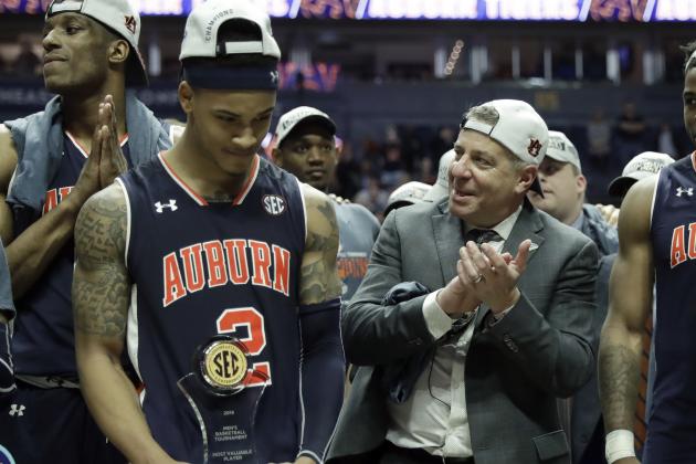 Auburn head coach Bruce Pearl applauds alongside Auburn's Bryce Brown (2) as they celebrate after defeating Tennessee in the championship game of the NCAA Southeastern Conference basketball tournament Sunday, March 17, 2019, in Nashville, Tenn. Auburn won 84-64. (AP Photo/Mark Humphrey)