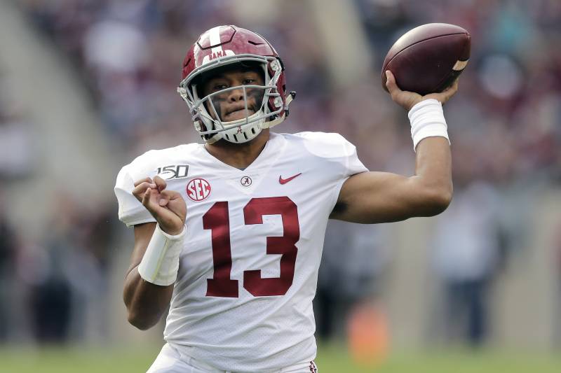 FILE - In this Oct. 12, 2019, file photo, Alabama quarterback Tua Tagovailoa passes against Texas A&M during the second half of an NCAA college football game in College Station, Texas. A high-stakes tilt between LSU and Alabama could prove as pivotal in Heisman Trophy voting as it is in providing the winner an inside track to the College Football Playoff. (AP Photo/Sam Craft, File)