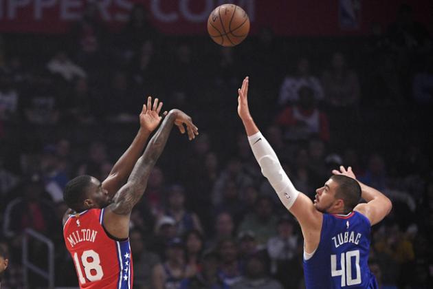 Philadelphia 76ers guard Shake Milton, left, shoots as Los Angeles Clippers center Ivica Zubac defends during the first half of an NBA basketball game Sunday, March 1, 2020, in Los Angeles. (AP Photo/Mark J. Terrill)