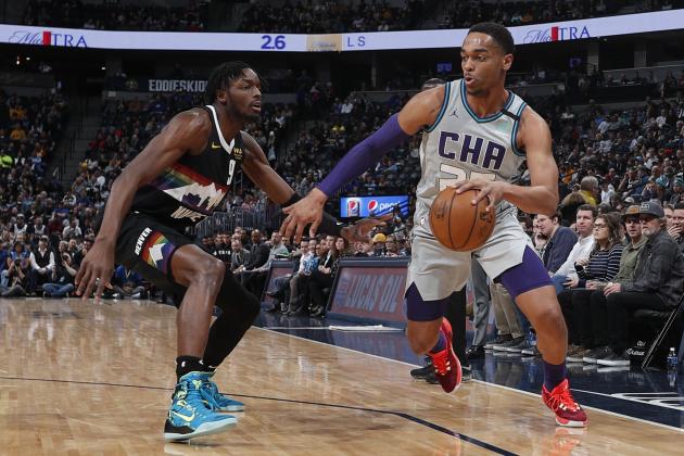 Charlotte Hornets forward PJ Washington (25) and Denver Nuggets forward Jerami Grant (9) in the first half of an NBA basketball game Wednesday, Jan. 15, 2020, in Denver. (AP Photo/David Zalubowski)