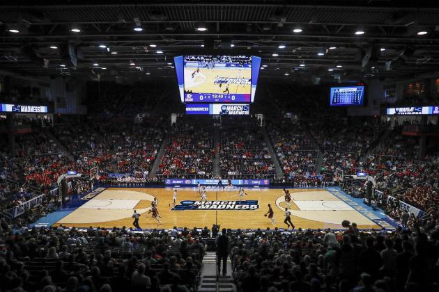 Spectators watch from the stands during the first half of a First Four game of the NCAA college basketball tournament between Temple and Belmont, Tuesday, March 19, 2019, in Dayton, Ohio. (AP Photo/John Minchillo)