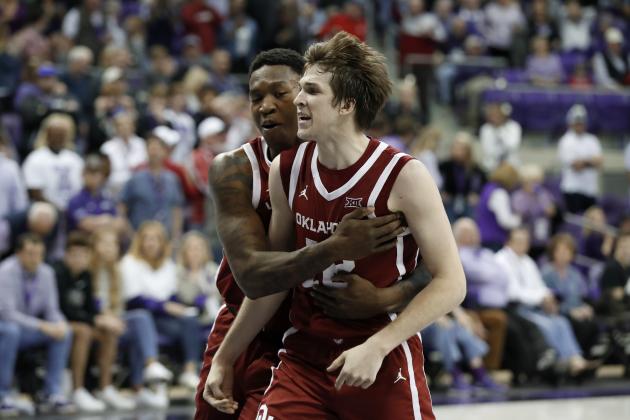 Oklahoma forward Kristian Doolittle, left, and guard Austin Reaves (12) celebrate a score By Reaves late in the second half of an NCAA college basketball game against TCU in Fort Worth, Texas, Saturday, March 7, 2020. (AP Photo/Tony Gutierrez)