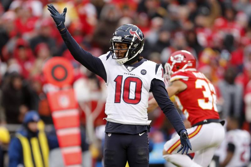Houston Texans wide receiver DeAndre Hopkins (10) motions first down during the first half of an NFL divisional playoff football game against the Kansas City Chiefs, in Kansas City, Mo., Sunday, Jan. 12, 2020. (AP Photo/Jeff Roberson)