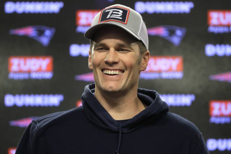 New England Patriots quarterback Tom Brady smiles while taking questions from reporters following an NFL football practice, Wednesday, Nov. 20, 2019, in Foxborough, Mass. (AP Photo/Steven Senne)