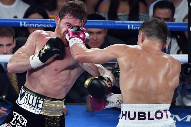 LAS VEGAS, NV - SEPTEMBER 15:  Gennady Golovkin (R) hits Canelo Alvarez in the third round of their WBC/WBA middleweight title fight at T-Mobile Arena on September 15, 2018 in Las Vegas, Nevada. Alvarez won by majority decision.  (Photo by Ethan Miller/Getty Images)