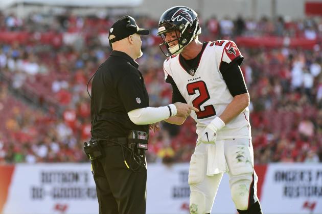TAMPA, FLORIDA - DECEMBER 30: Head coach Dan Quinn and Matt Ryan #2 of the Atlanta Falcons discuss the next play during the final minute of a 34-32 win over Tampa Bay Buccaneers gets at Raymond James Stadium on December 30, 2018 in Tampa, Florida. (Photo by Julio Aguilar/Getty Images)