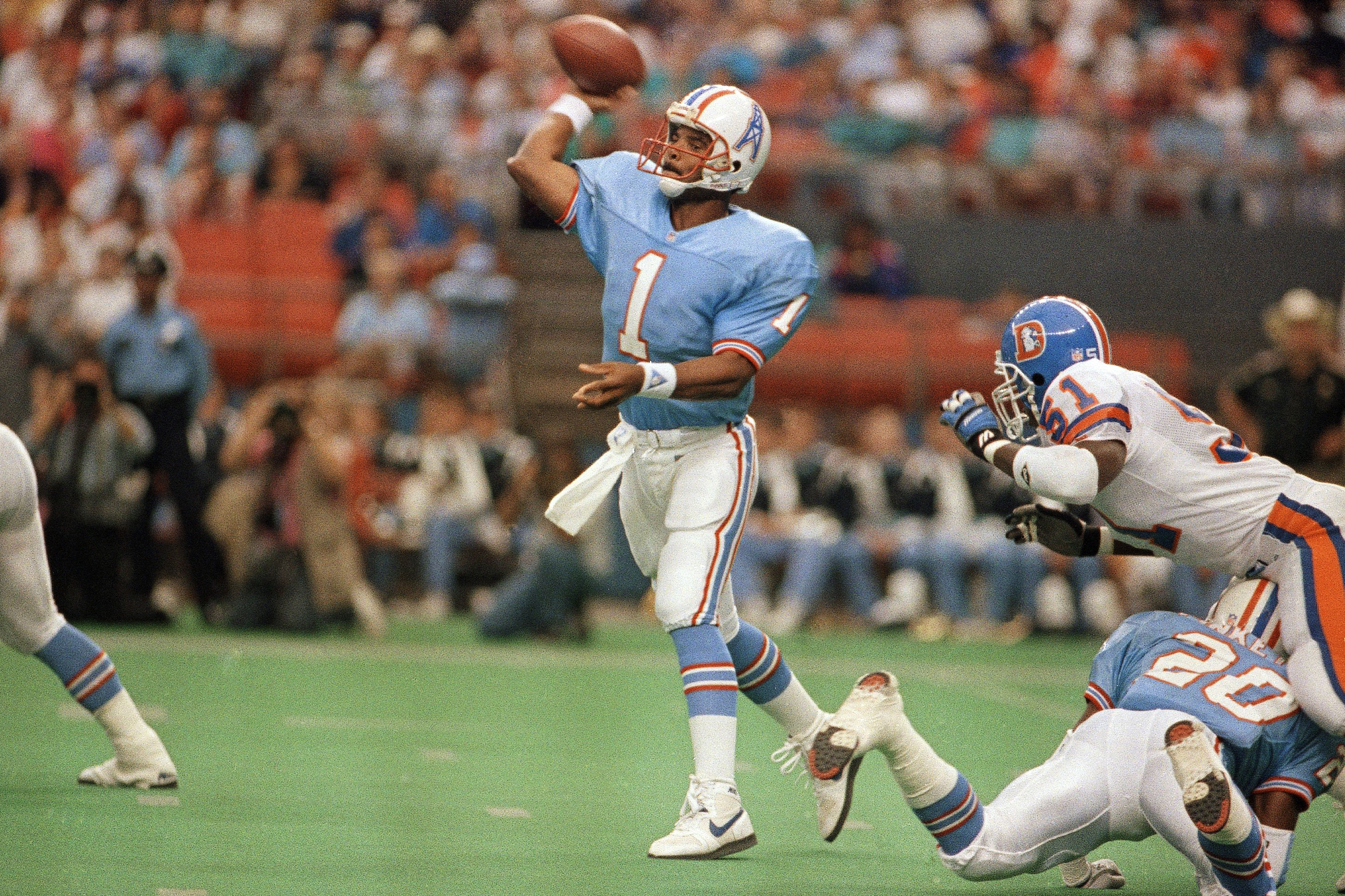 Houston Oilers running back Earl Campbell (34), tries to run