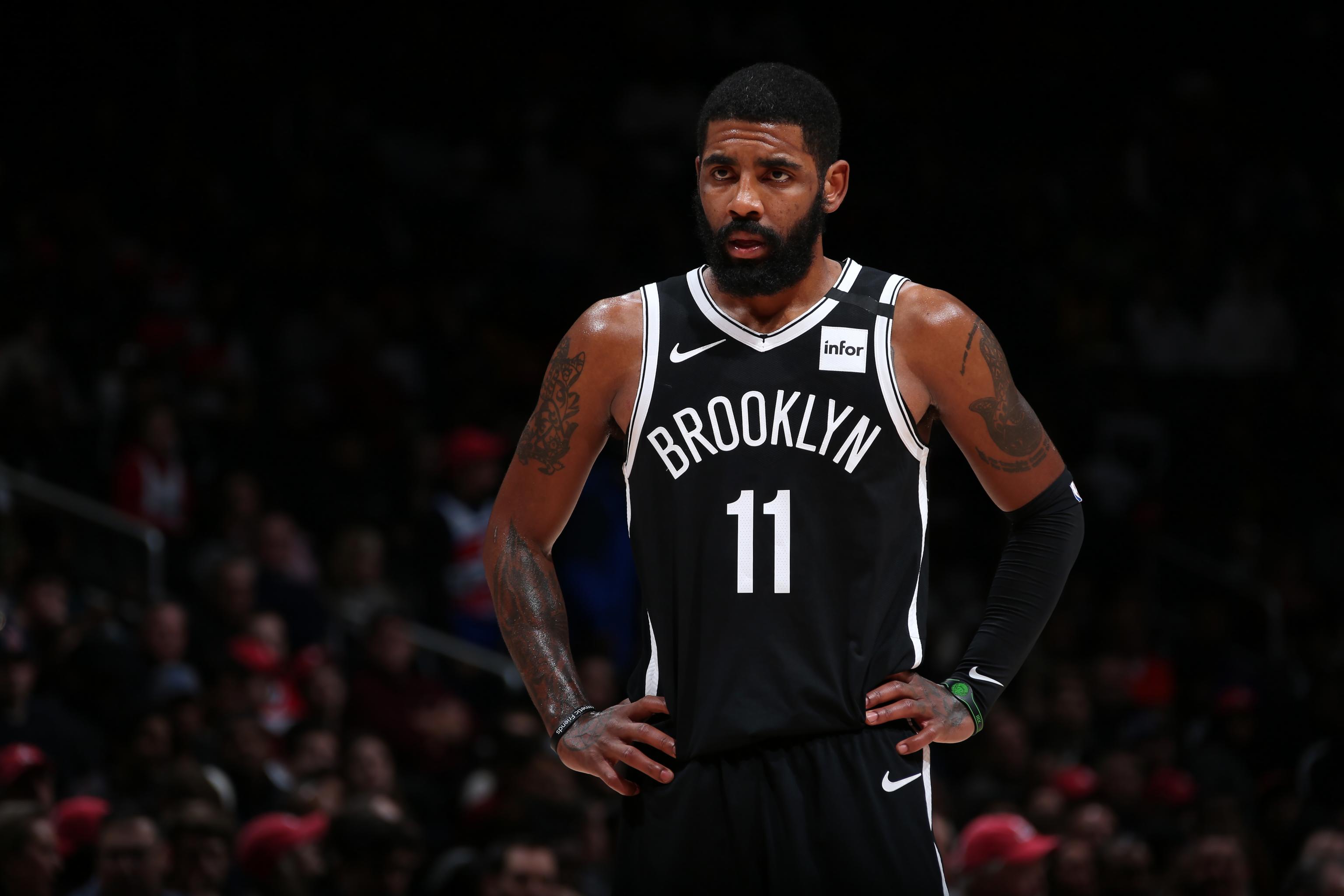 Nets' Kyrie Irving signs fan's jersey salvaged from fire - ESPN