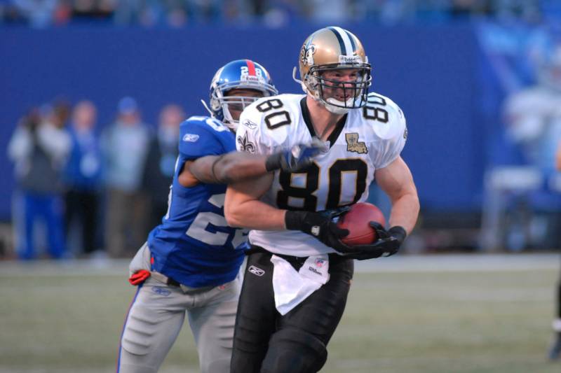 New York Giants # 28 Gibril Wilson trying to tackle New Orleans Saints Tight end  # 80 Mark Campbell during the New Orleans Saints vs New York Giants game on December 24, 2006 at Giants Stadium final score Giants 7 Saints 30 (Photo by Tom Berg/NFLPhotoLibrary)