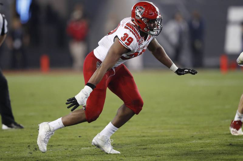 JACKSONVILLE, FL - DECEMBER 31: James Smith-Williams #39 of the North Carolina State Wolfpack in action against the Texas A&M Aggies during the TaxSlayer Gator Bowl at TIAA Bank Field on December 31, 2018 in Jacksonville, Florida. Texas A&M won 52-13. (Photo by Joe Robbins/Getty Images)