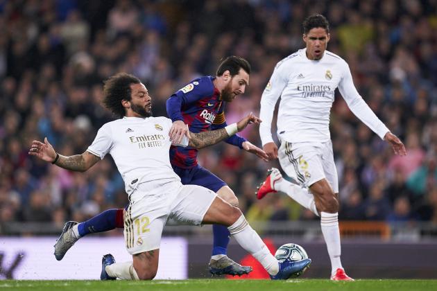 MADRID, SPAIN - MARCH 01: Marcelo Vieira of Real Madrid competes for the ball with Lionel Messi of FC Barcelona during the La Liga match between Real Madrid CF and FC Barcelona at Estadio Santiago Bernabeu on March 01, 2020 in Madrid, Spain. (Photo by Mateo Villalba/Quality Sport Images/Getty Images)