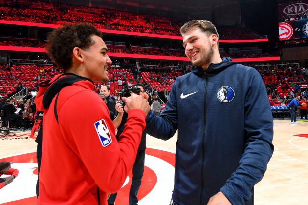 ATLANTA, GA - OCTOBER 24: Trae Young #11 of the Atlanta Hawks and Luka Doncic #77 of the Dallas Mavericks talk before the game on October 24, 2018 at State Farm Arena in Atlanta, Georgia. NOTE TO USER: User expressly acknowledges and agrees that, by downloading and/or using this photograph, user is consenting to the terms and conditions of the Getty Images License Agreement. Mandatory Copyright Notice: Copyright 2018 NBAE (Photo by Scott Cunningham/NBAE via Getty Images)