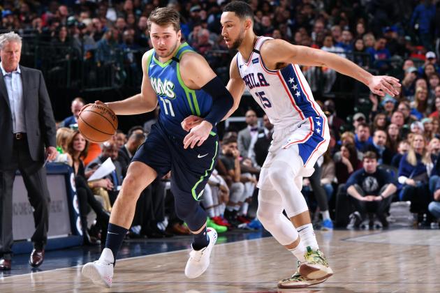 DALLAS, TX - JANUARY 11: Luka Doncic #77 of the Dallas Mavericks handles the ball while Ben Simmons #25 of the Philadelphia 76ers plays defense during the game on January 11, 2020 at the American Airlines Center in Dallas, Texas. NOTE TO USER: User expressly acknowledges and agrees that, by downloading and or using this photograph, User is consenting to the terms and conditions of the Getty Images License Agreement. Mandatory Copyright Notice: Copyright 2020 NBAE (Photo by Glenn James/NBAE via Getty Images)