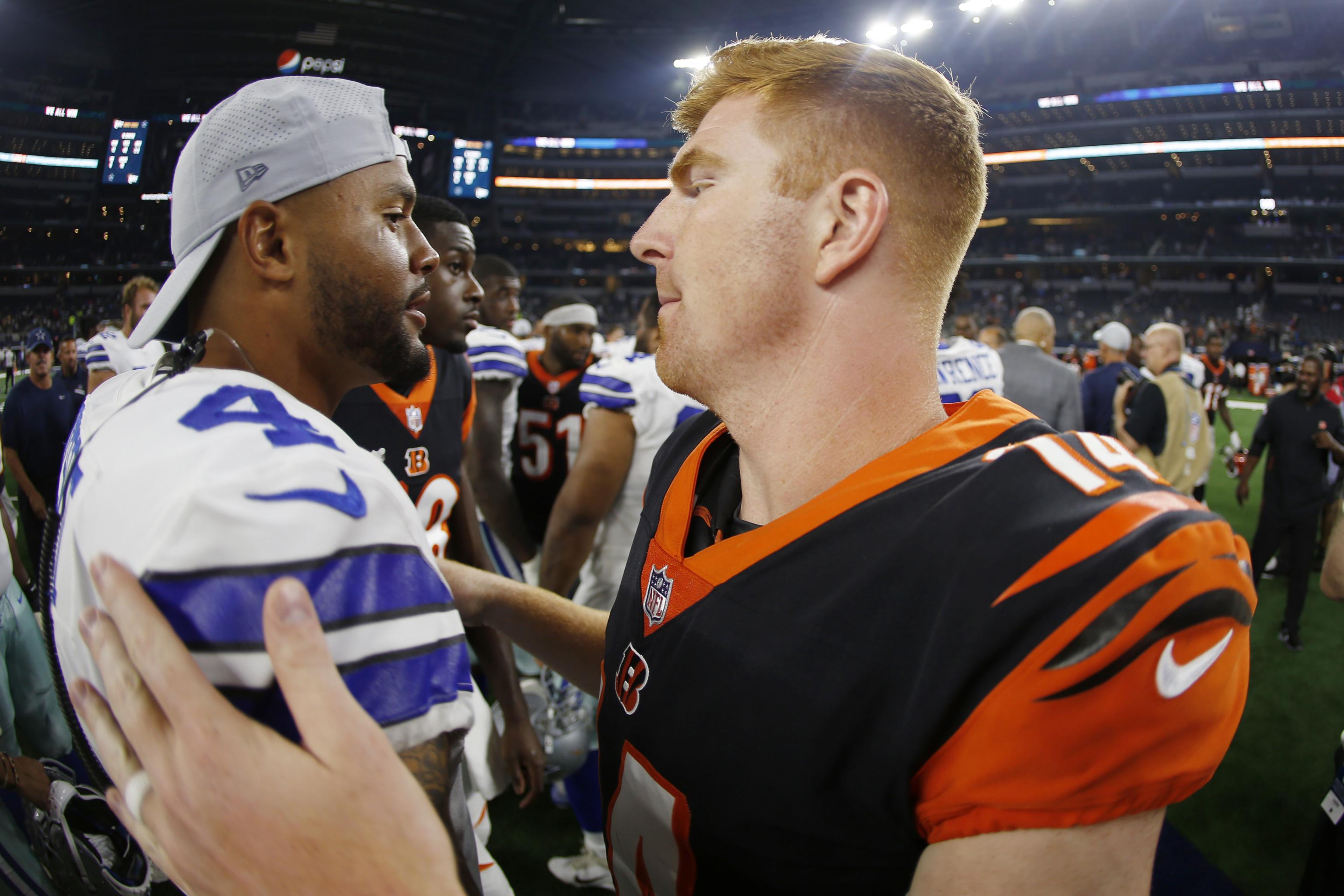 Photos: Dak Prescott connects with new QB Andy Dalton, and more on