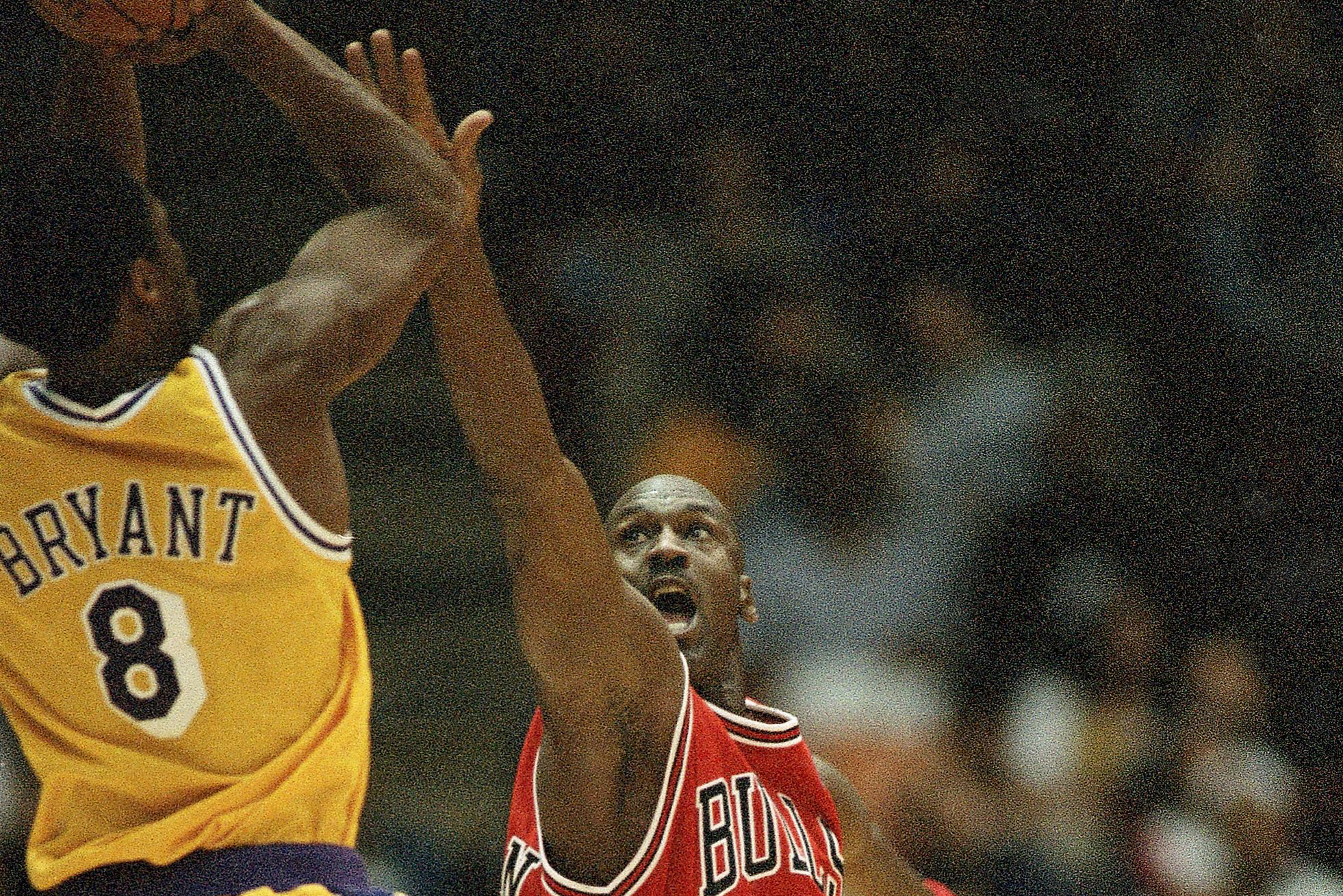 MJ giving Kobe Bryant advice during a game in 1997