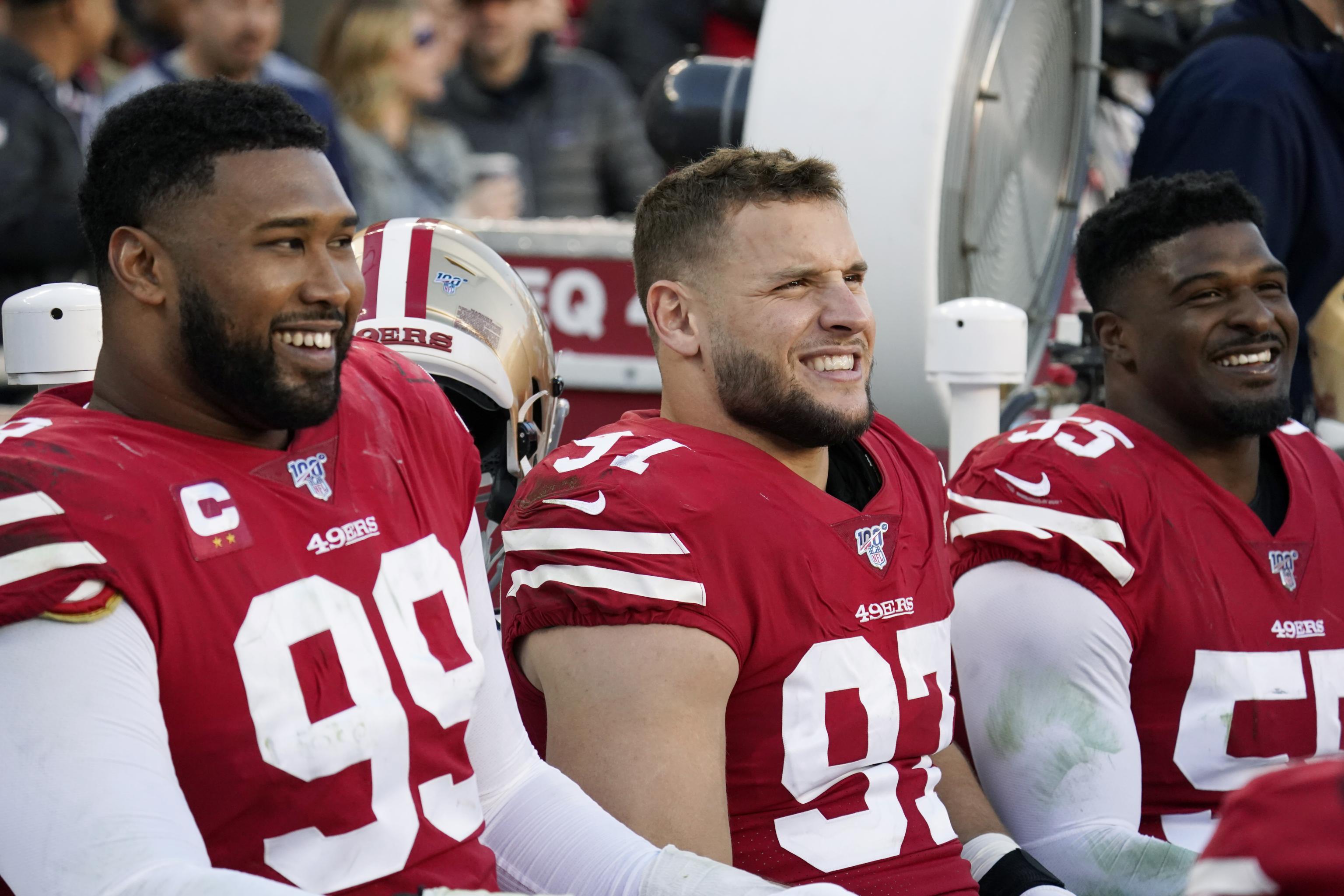 Miami Gardens, Florida, USA. 2nd Feb, 2020. San Francisco 49ers defensive  tackle DeForest Buckner (99) comforts San Francisco 49ers defensive end  Nick Bosa (97) after the Chiefs beat the 49ers 31-20 in