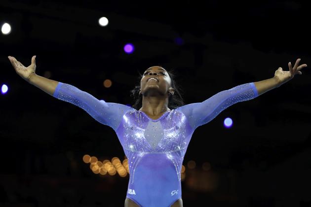 Gold medalist Simone Biles of the United States performs on the floor in the women's apparatus finals at the Gymnastics World Championships in Stuttgart, Germany, Sunday, Oct. 13, 2019. (AP Photo/Matthias Schrader)
