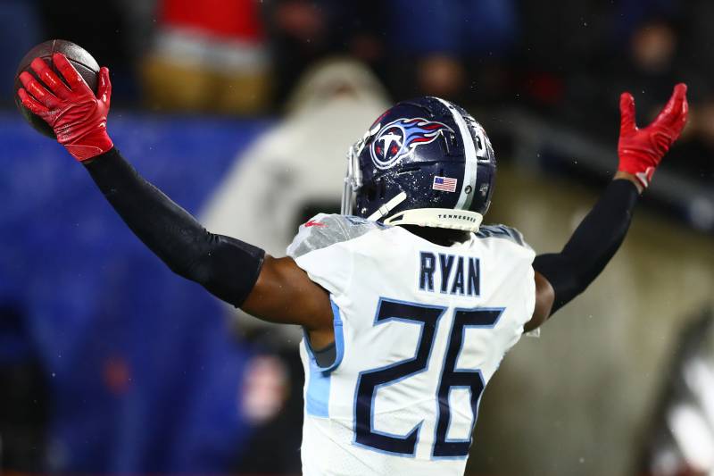 FOXBOROUGH, MASSACHUSETTS - JANUARY 04: Logan Ryan #26 of the Tennessee Titans celebrates his touchdown against the New England Patriots in the fourth quarter of the AFC Wild Card Playoff game at Gillette Stadium on January 04, 2020 in Foxborough, Massachusetts. (Photo by Adam Glanzman/Getty Images)