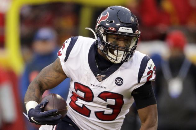Houston Texans running back Carlos Hyde (23) carries the ball during the first half of an NFL divisional playoff football game against the Kansas City Chiefs, in Kansas City, Mo., Sunday, Jan. 12, 2020. (AP Photo/Charlie Riedel)