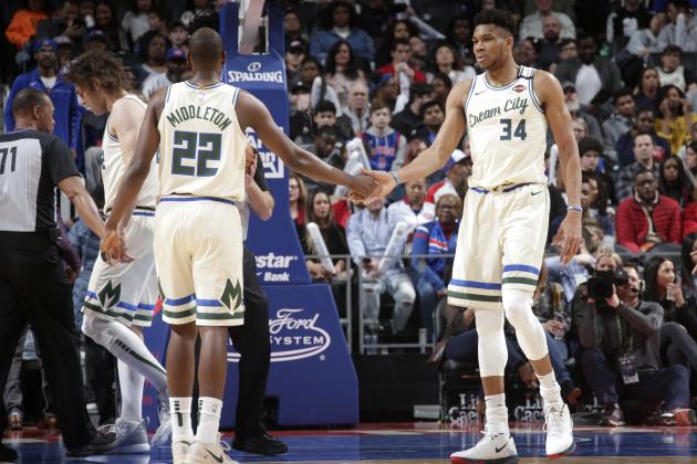 DETROIT, MI - FEBRUARY 20: Khris Middleton #22 of the Milwaukee Bucks high-fives Giannis Antetokounmpo #34 of the Milwaukee Bucks against the Detroit Pistons on February 20, 2020 at Little Caesars Arena in Detroit, Michigan. NOTE TO USER: User expressly acknowledges and agrees that, by downloading and/or using this photograph, User is consenting to the terms and conditions of the Getty Images License Agreement. Mandatory Copyright Notice: Copyright 2020 NBAE (Photo by Brian Sevald/NBAE via Getty Images)