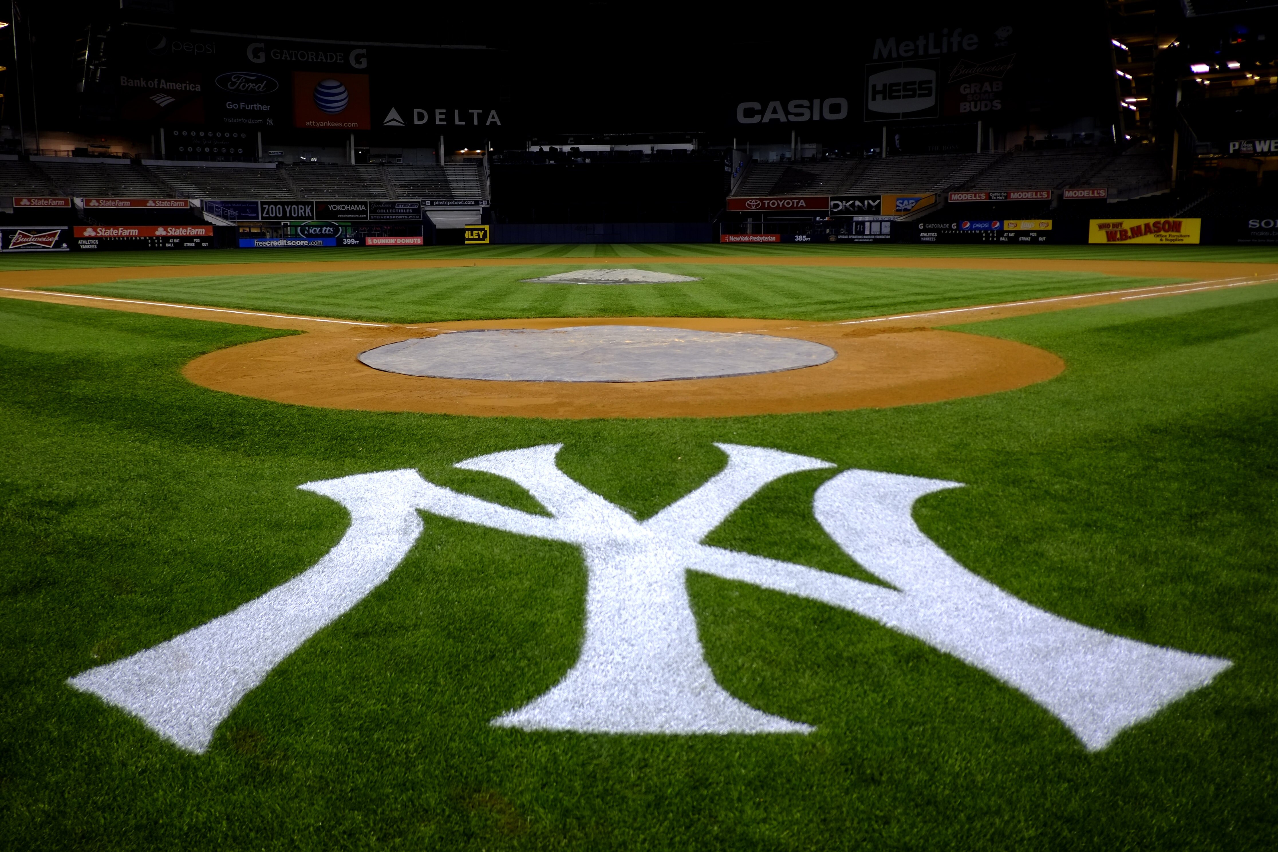 The New York Yankees logo is seen behind home plate at Yankee Stadium in New York following a baseball game against the Oakland Athletics, Friday, May 3, 2013. The Athletics won 2-0. (AP Photo/Julio Cortez)