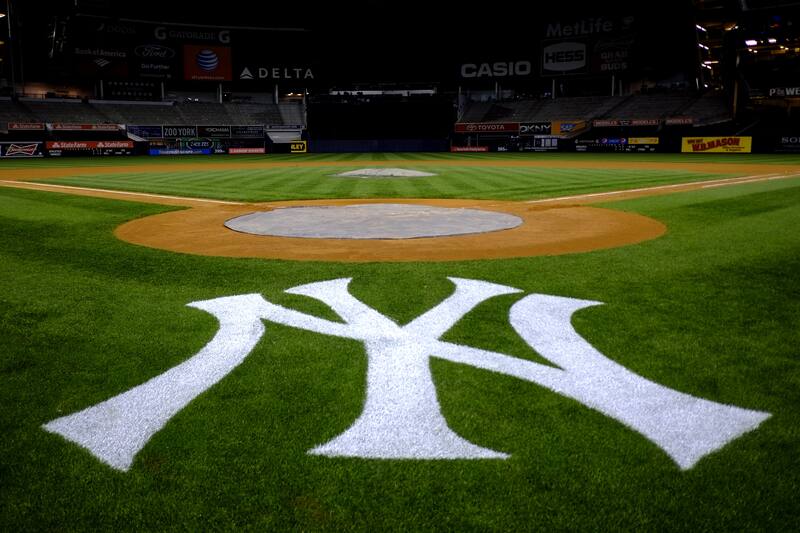 The New York Yankees logo is seen behind home plate at Yankee Stadium in New York following a baseball game against the Oakland Athletics, Friday, May 3, 2013. The Athletics won 2-0. (AP Photo/Julio Cortez)