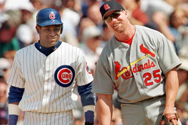 The Chicago Cubs' Sammy Sosa stands with St. Louis Cardinal's first baseman Mark McGwire between pitches after Sosa singled in the second inning 28 May, 1999, at Wrigley Field in Chicago, Illinois. It was the first time the pair had played each other since last year's home run race. The Cubs won 6-3 with help from a home run from Sosa.    AFP PHOTO/John ZICH (Photo by JOHN ZICH / AFP)        (Photo credit should read JOHN ZICH/AFP via Getty Images)