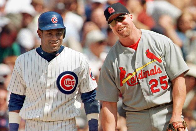 The Chicago Cubs' Sammy Sosa stands with St. Louis Cardinal's first baseman Mark McGwire between pitches after Sosa singled in the second inning 28 May, 1999, at Wrigley Field in Chicago, Illinois. It was the first time the pair had played each other since last year's home run race. The Cubs won 6-3 with help from a home run from Sosa.    AFP PHOTO/John ZICH (Photo by JOHN ZICH / AFP)        (Photo credit should read JOHN ZICH/AFP via Getty Images)