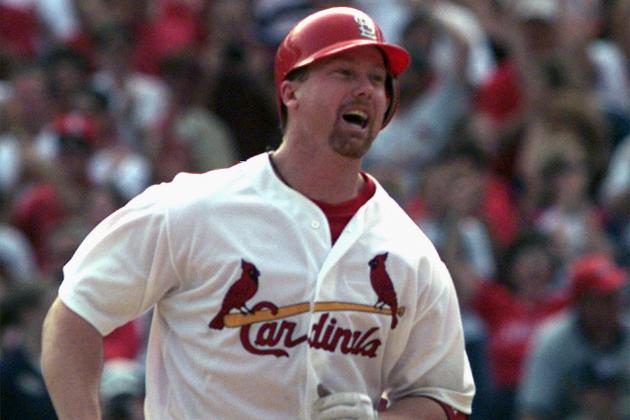 FILE - In this Sept. 27, 1998, file photo, St. Louis Cardinals slugger Mark McGwire smiles as he rounds the bases after hitting his 70th home run of the season in the seventh inning against Montreal Expos pitcher Carl Pavano, at Busch Stadium in St. Louis.  McGwire says he could have hit 70 home runs in a season without taking performance-enhancing drugs. He tells The Athletic he regrets taking the drugs because he