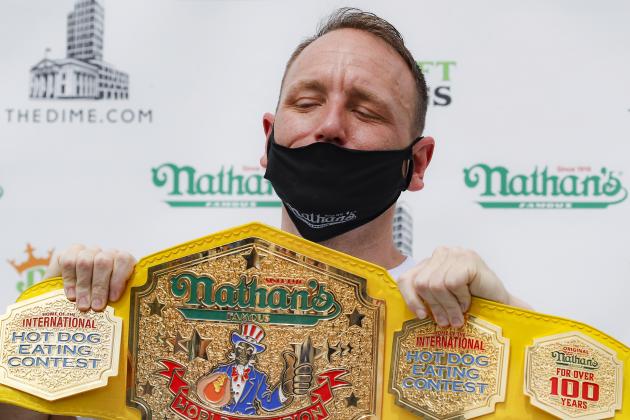 Competitive eater Joey Chestnut holds his championship belt during a weigh-in before the Nathan's Famous July Fourth hot dog eating contest, Friday, July 3, 2020, in the Brooklyn borough of New York. The weigh-in was held in a private, socially-distanced ceremony in the Williamsburg neighborhood due to COVID-19 concerns. (AP Photo/John Minchillo)