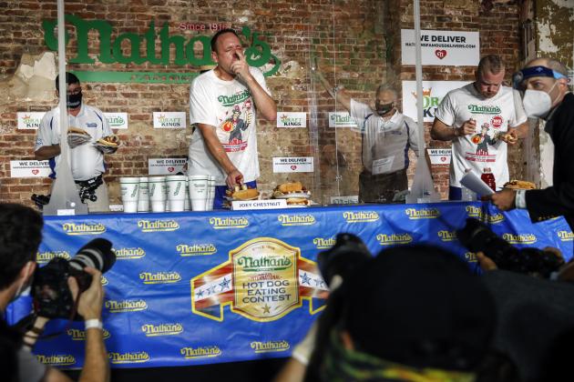 Competitive eater Joey Chestnut sets a new world record with 75 hot dogs to win the men's division of the Nathan's Famous July Fourth hot dog eating contest, Saturday, July 4, 2020, in the Brooklyn borough of New York. AP Photo/John Minchillo)
