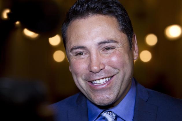 FILE - In this June 26, 2014 file photo, boxer Oscar De La Hoya talks with reporters in Sacramento, Calif. Of all the things Donald Trump has been called on the campaign trail, this one might sting the most: golf cheat. De La Hoya says that's what he saw on the links when Trump joined up with his group at Trump National Golf Club in Los Angeles two years ago. Trump, he said, cheated not once but twice in the space of two holes. (AP Photo/Steve Yeater, File)