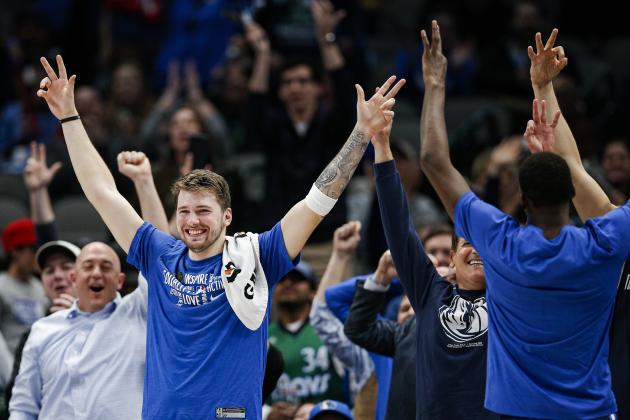 Dallas Mavericks guard Luka Doncic celebrates a three-pointer scored by Dallas Mavericks forward Boban Marjanovic, not pictured, during the second half of an NBA basketball game against the Sacramento Kings, Wednesday, Feb. 12, 2020, in Dallas. Dallas won 130-111. (AP Photo/Brandon Wade)