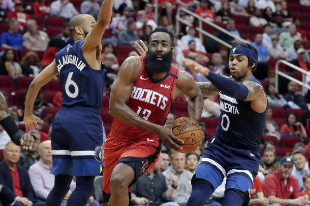 Houston Rockets guard James Harden (13) drives to the basket between Minnesota Timberwolves guard Jordans McLaughlin (6) and D'Angelo Russell (0) during the second half of an NBA basketball game Tuesday, March 10, 2020, in Houston. (AP Photo/Michael Wyke)