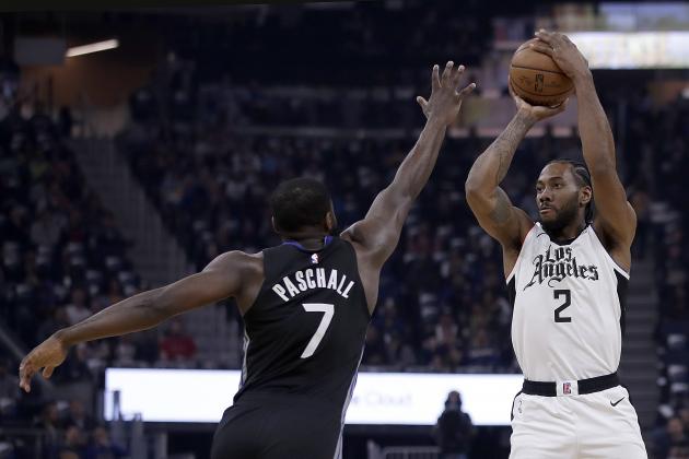 Los Angeles Clippers' Kawhi Leonard, right, shoots against Golden State Warriors' Eric Paschall (7) during the first half of an NBA basketball game Tuesday, March 10, 2020, in San Francisco. (AP Photo/Ben Margot)
