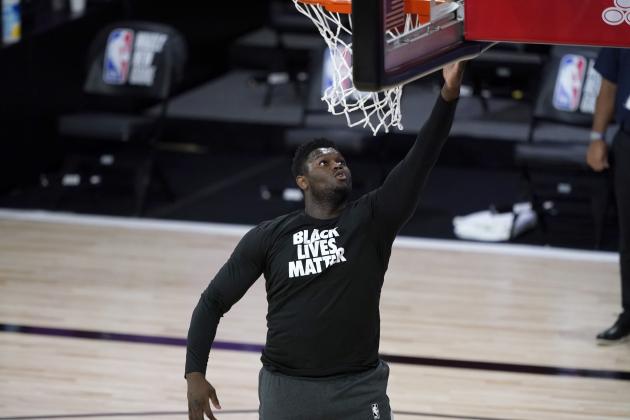 New Orleans Pelicans' Zion Williamson wears a Black Lives Matter shirt while warming up before the start of an NBA basketball game against the Utah Jazz Thursday, July 30, 2020, in Lake Buena Vista, Fla. (AP Photo/Ashley Landis, Pool)