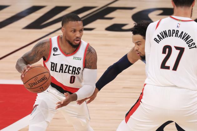 Portland Trail Blazers' Damian Lillard (0) dribbles during the first half of an NBA basketball game against the Memphis Grizzlies, Friday, July 31, 2020, in Lake Buena Vista, Fla. (Mike Ehrmann/Pool Photo via AP)