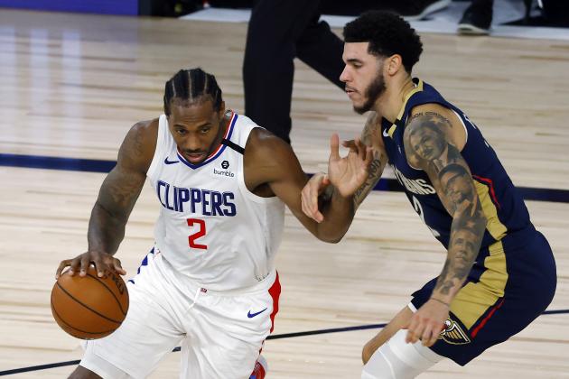 Los Angeles Clippers' Kawhi Leonard, left, drives against New Orleans Pelicans' Lonzo Ball, right, during an NBA basketball game Saturday, Aug. 1, 2020, in Lake Buena Vista, Fla. (Kevin C. Cox/Pool Photo via AP)