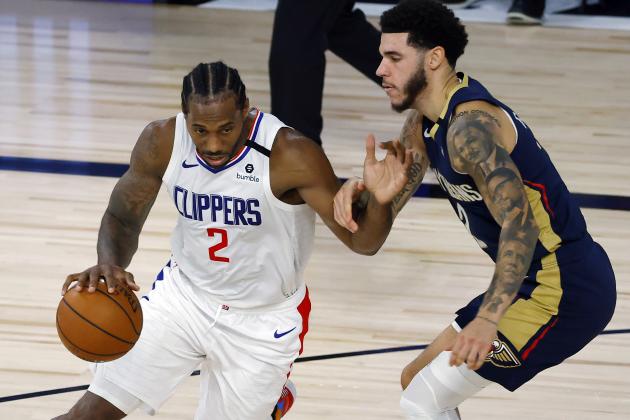 Los Angeles Clippers' Kawhi Leonard, left, drives against New Orleans Pelicans' Lonzo Ball, right, during an NBA basketball game Saturday, Aug. 1, 2020, in Lake Buena Vista, Fla. (Kevin C. Cox/Pool Photo via AP)