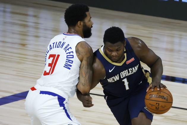 Los Angeles Clippers' Marcus Morris Sr., left, defends against New Orleans Pelicans' Zion Williamson during the first half of an NBA basketball game Saturday, Aug. 1, 2020, in Lake Buena Vista, Fla. (Kevin C. Cox/Pool Photo via AP)
