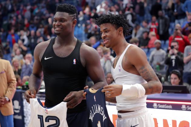 New Orleans Pelicans forward Zion Williamson, left, and Memphis Grizzlies guard Ja Morant exchange jerseys after an NBA basketball game in New Orleans, Friday, Jan. 31, 2020. The Pelicans won 139-111. (AP Photo/Gerald Herbert)