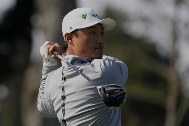 Haotong Li of China, watches his tee shot on the ninth hole during the second round of the PGA Championship golf tournament at TPC Harding Park Friday, Aug. 7, 2020, in San Francisco. (AP Photo/Charlie Riedel)