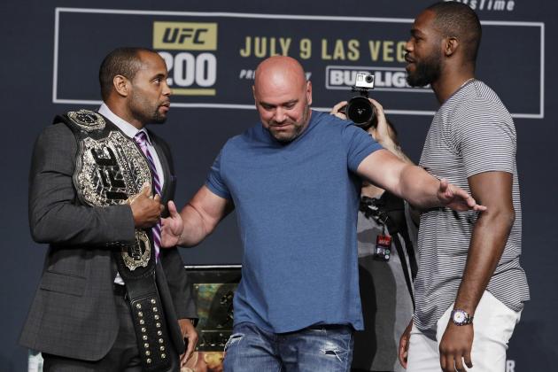 Dana White, center, stands between Daniel Cormier, left, and Jon Jones during a UFC 200 mixed martial arts news conference, Wednesday, July 6, 2016, in Las Vegas. Cormier and Jones are scheduled to fight in a light heavyweight championship fight at UFC 200 on Saturday. (AP Photo/John Locher)